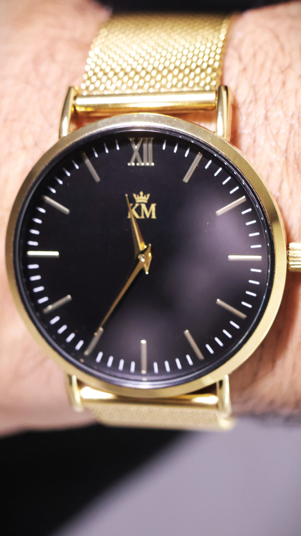 Gold and Black "KM" Watch