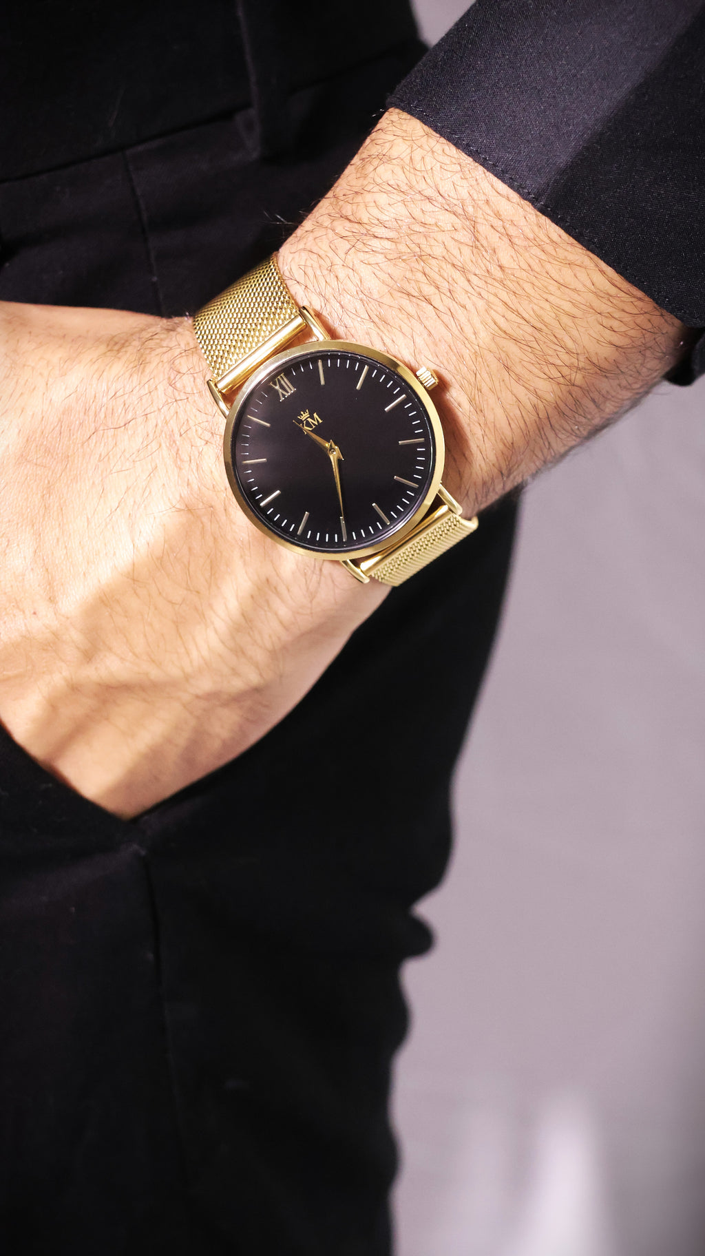 Gold and Black "KM" Watch