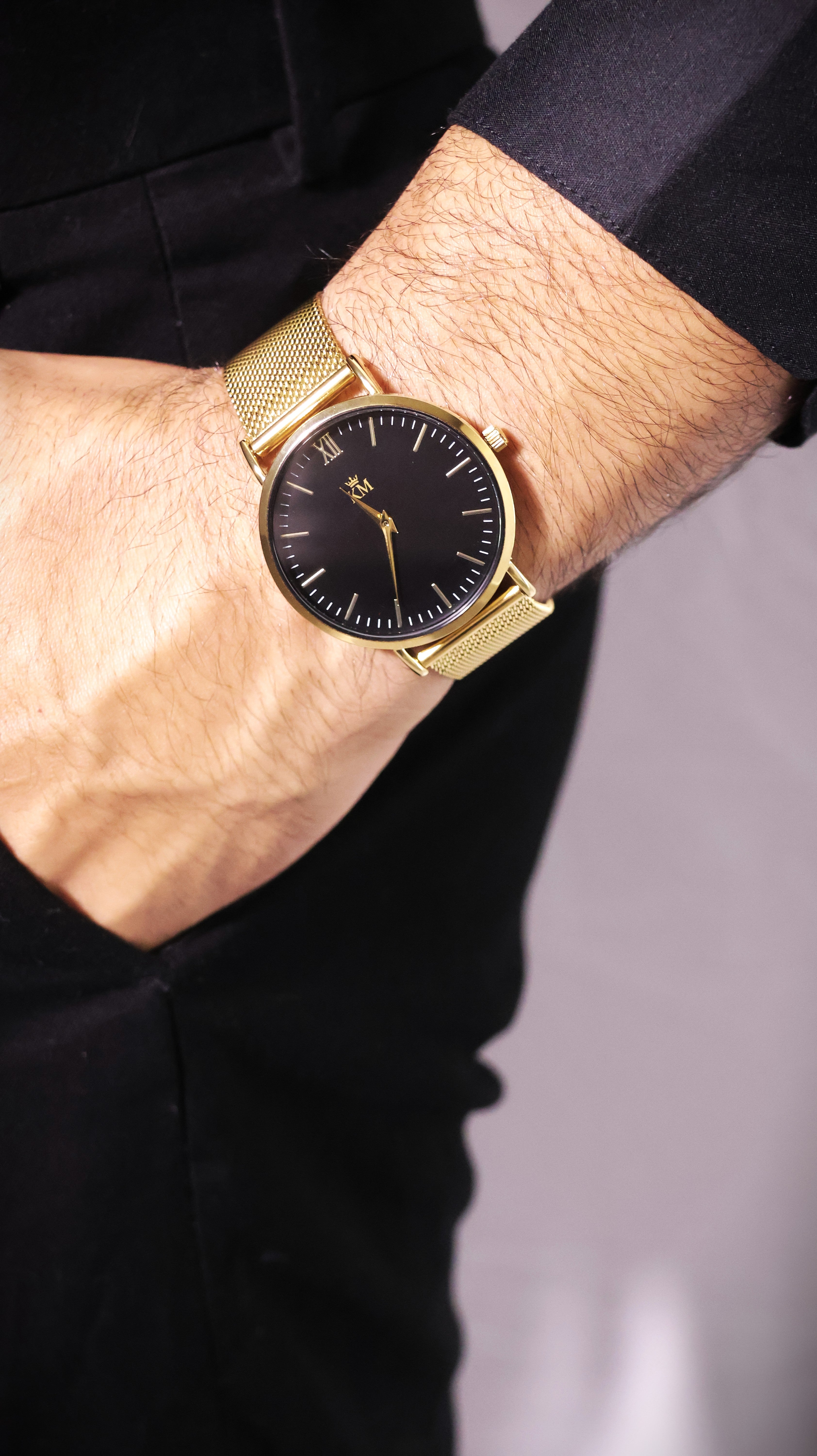 Gold and Black "KM" Watch